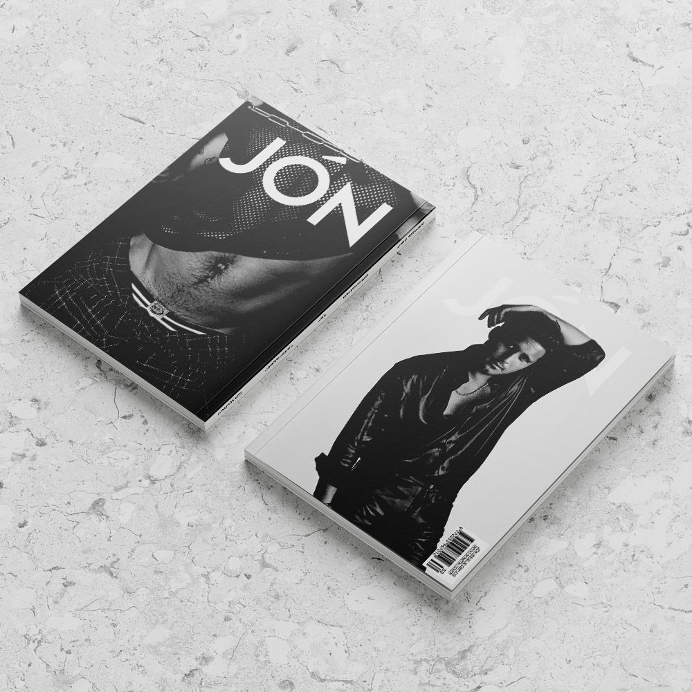 Front and back cover mockup of JÓN Magazine with black and white photography set on a marble background.