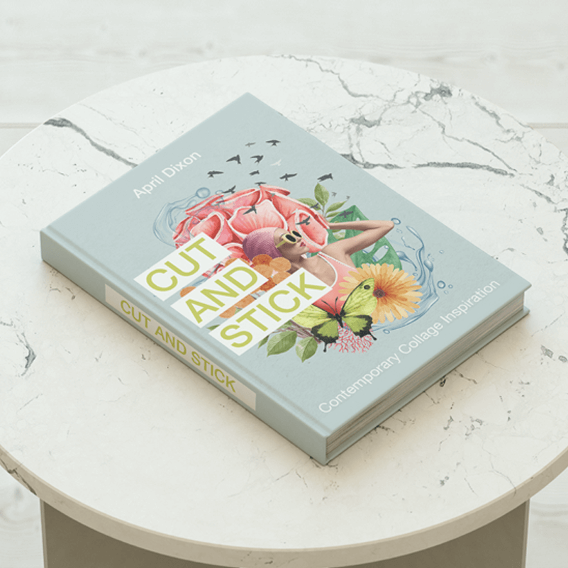 A hardcover book about collage lays flat on a marble table