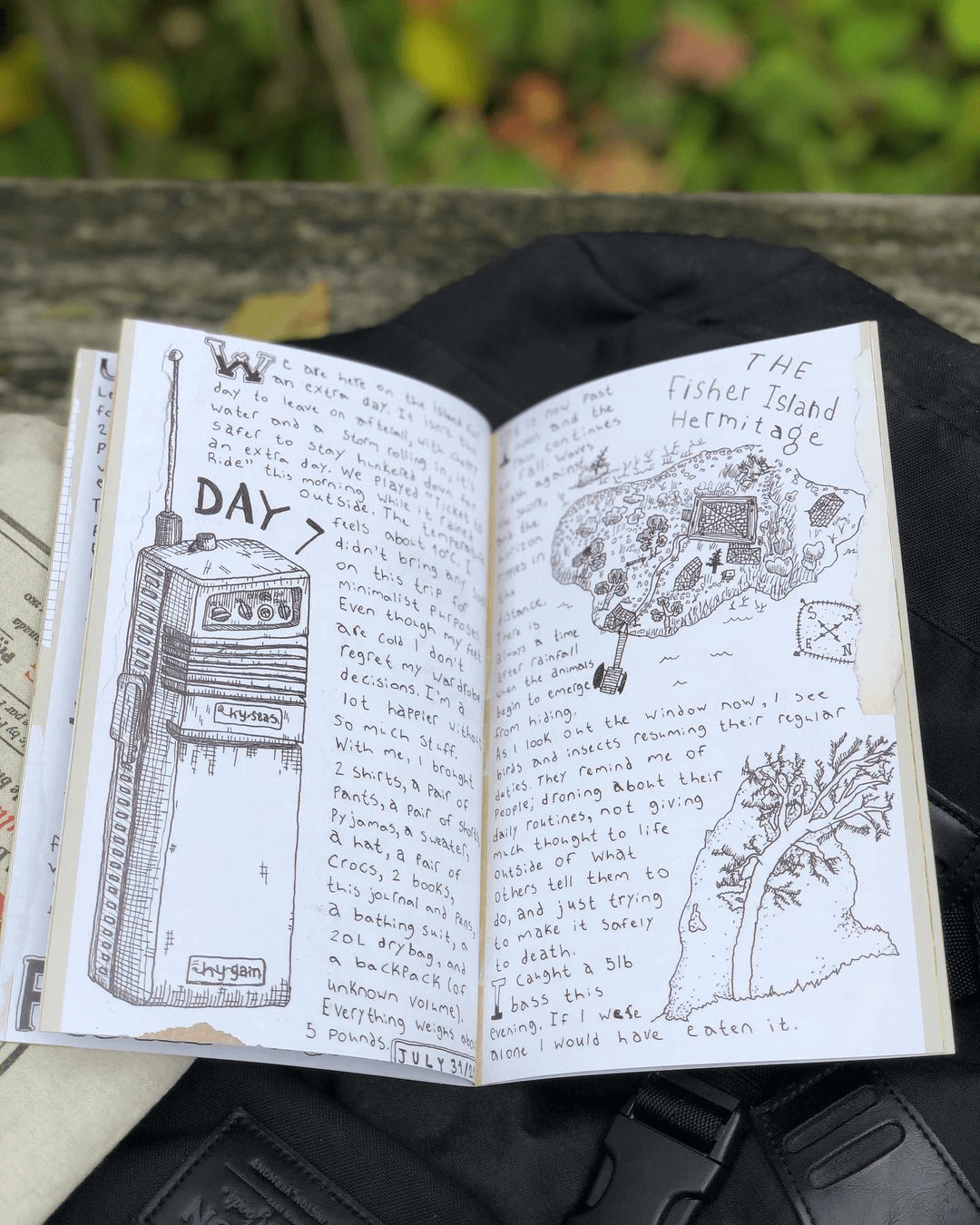 A double-page spread of a printed zine featuring handwritten text and illustrations.