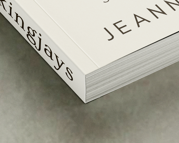 Close-up of a booklet corner showing perfect binding with glued spine and flexible cover.