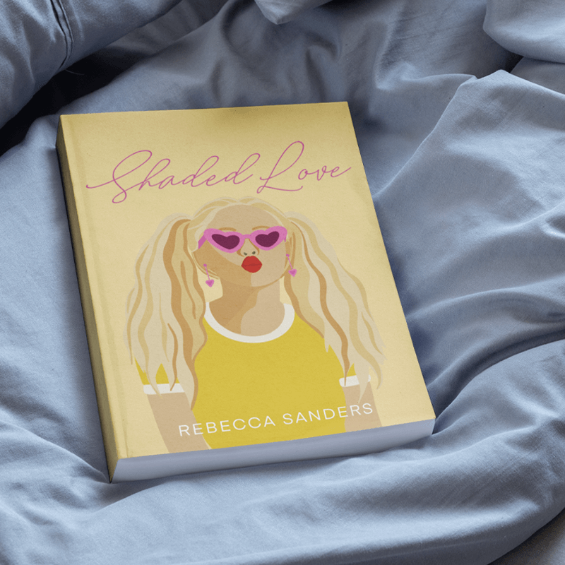 A closed paperback book with a girl wearing sunglasses on the cover